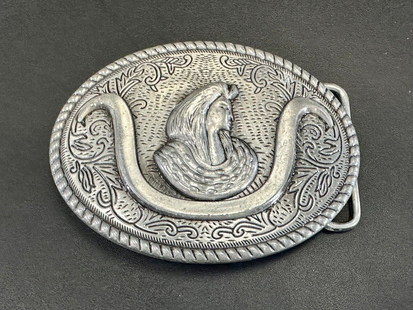 unknown to me!   Man with long hair - longhorn wester belt buckle