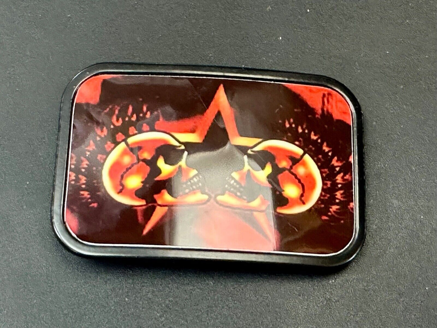 Two Skulls around star picture - black & red color rectangular belt buckle