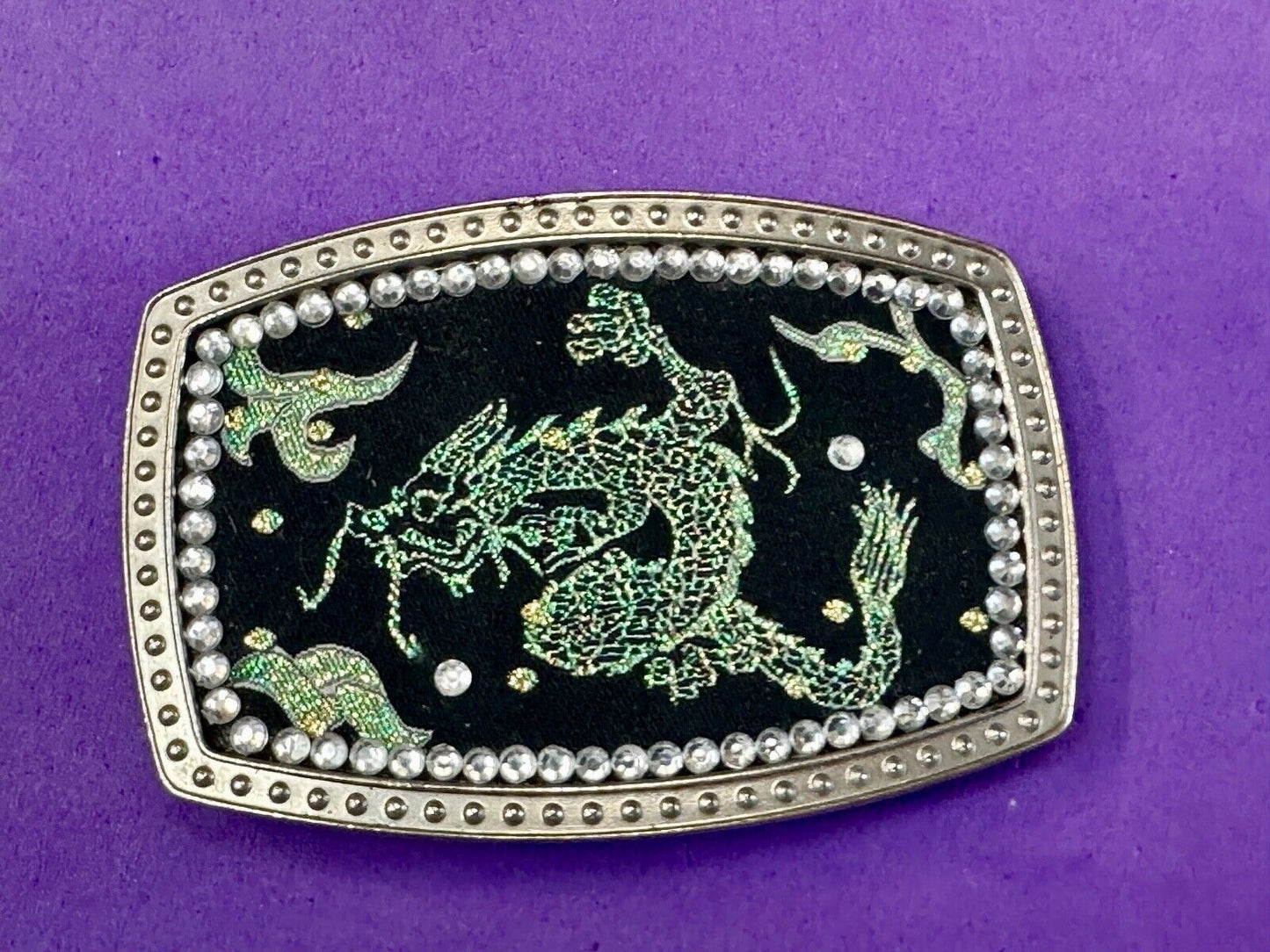 Chinese Dragon pattern symbol on silver tone rhinestone accented belt buckle