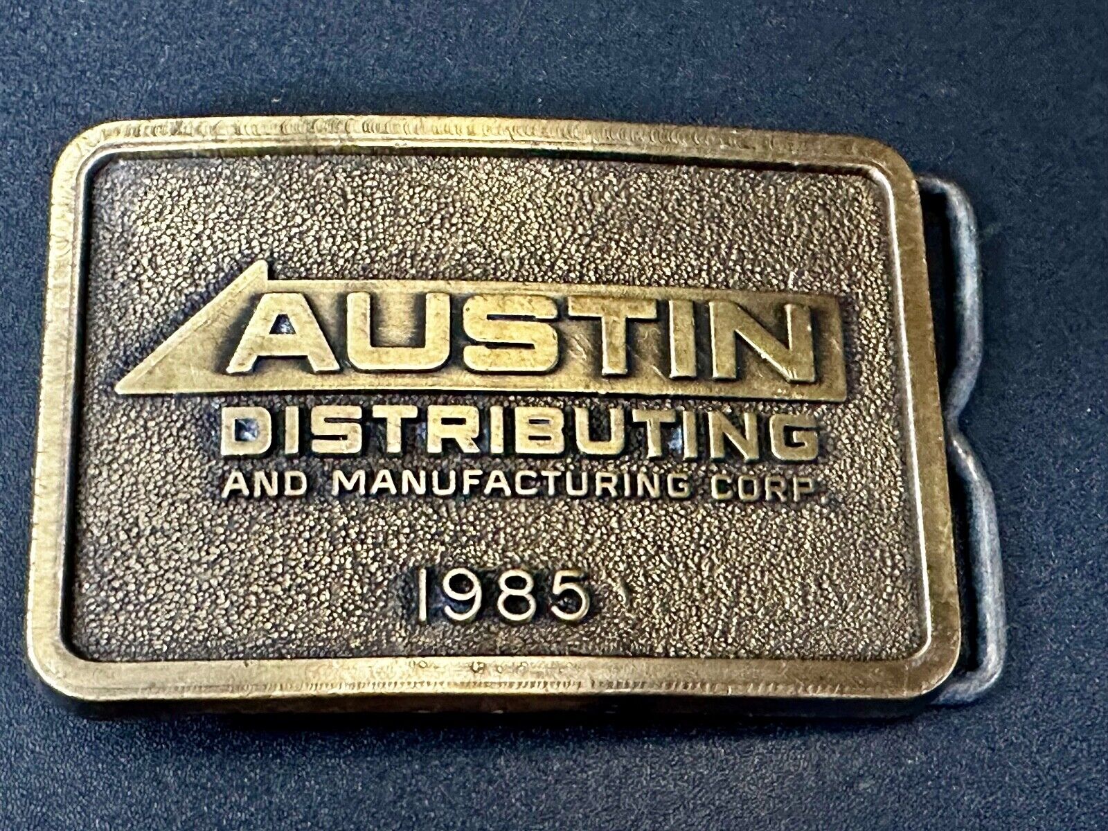 Austin Texas Distributing and Manufacturing 1985 Advertisement Promo Belt Buckle