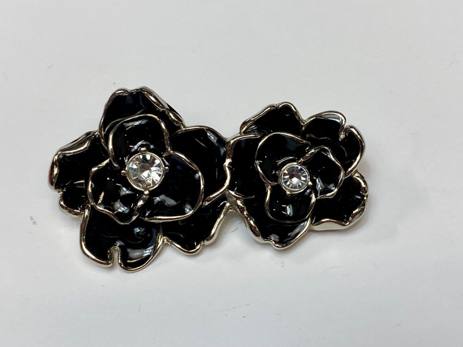 Beautiful two figural flowers with jewels as black & silver colored belt buckle