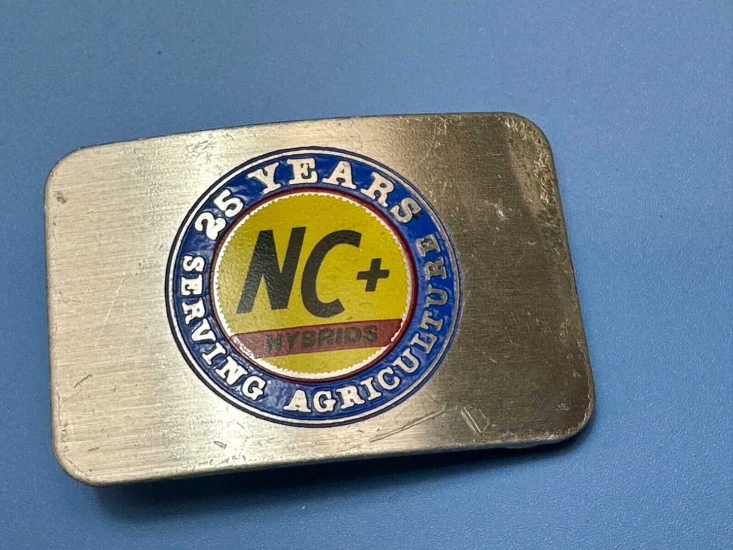 25 years serving agriculture - NC+ Hybrids Farmers Agriculture belt buckle