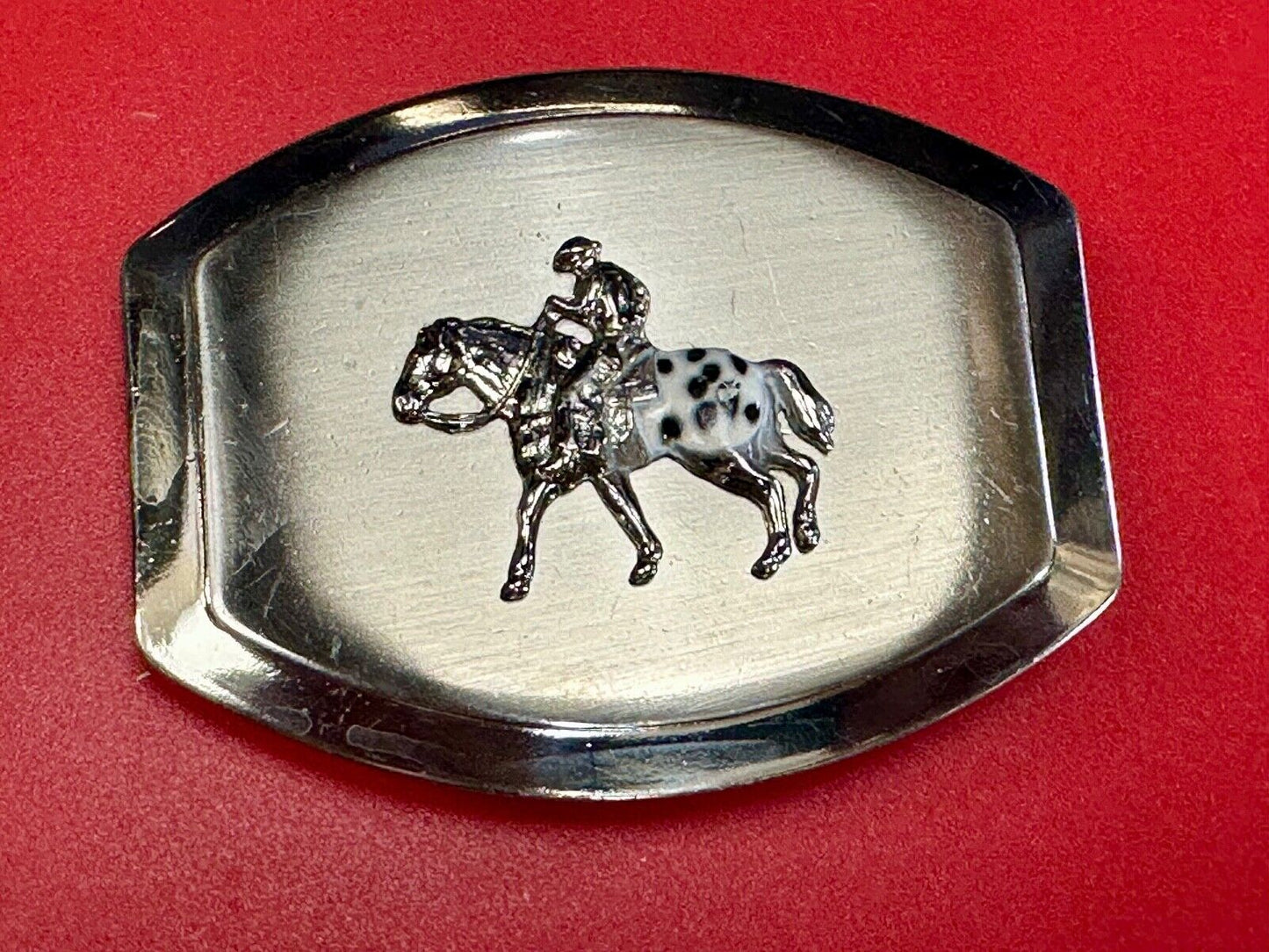 Vintage Horseback Riders cowboys belt buckle with black & white enamel accents