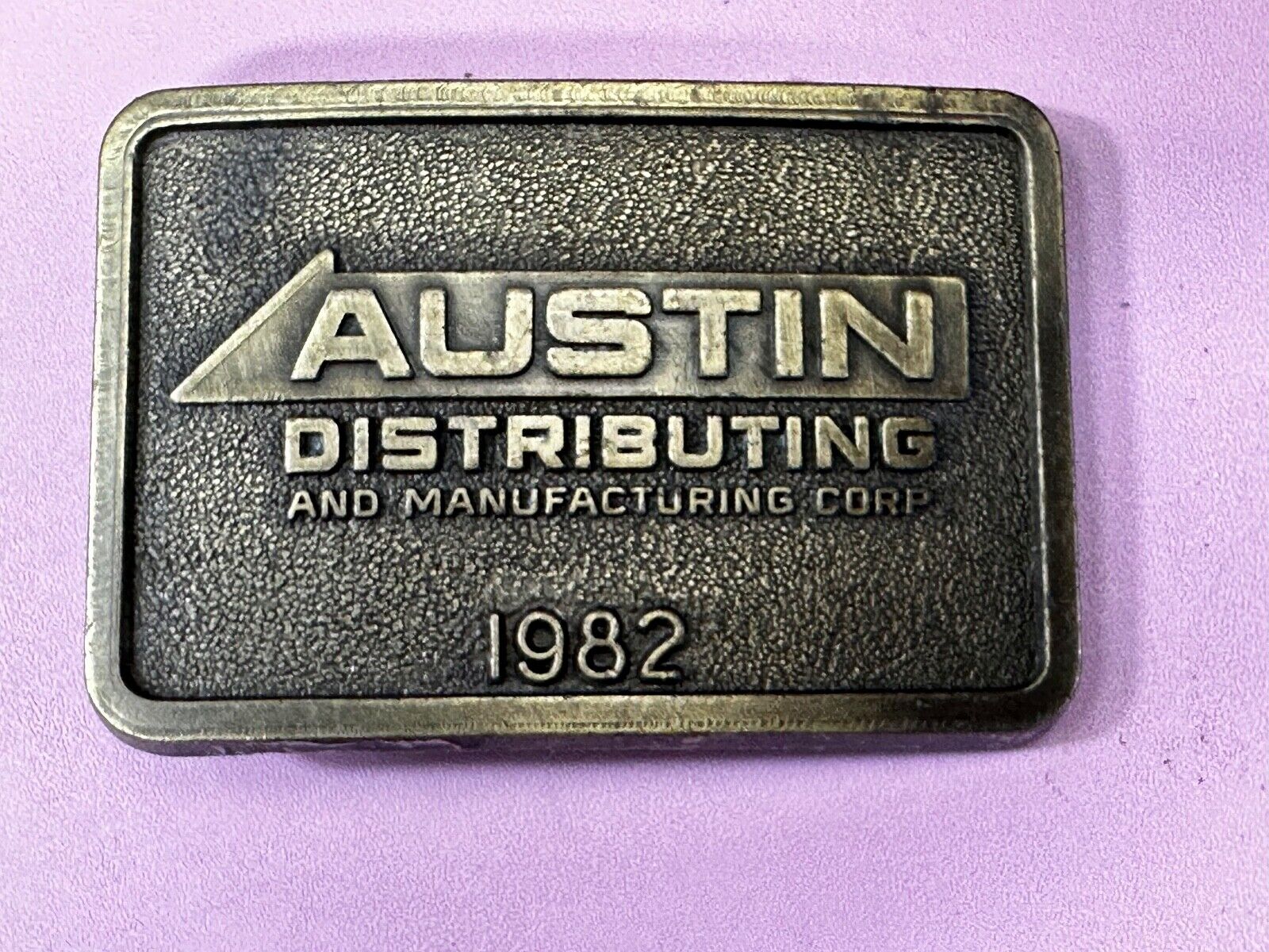 Austin Texas Distributing and Manufacturing 1982 Advertisement Promo Belt Buckle