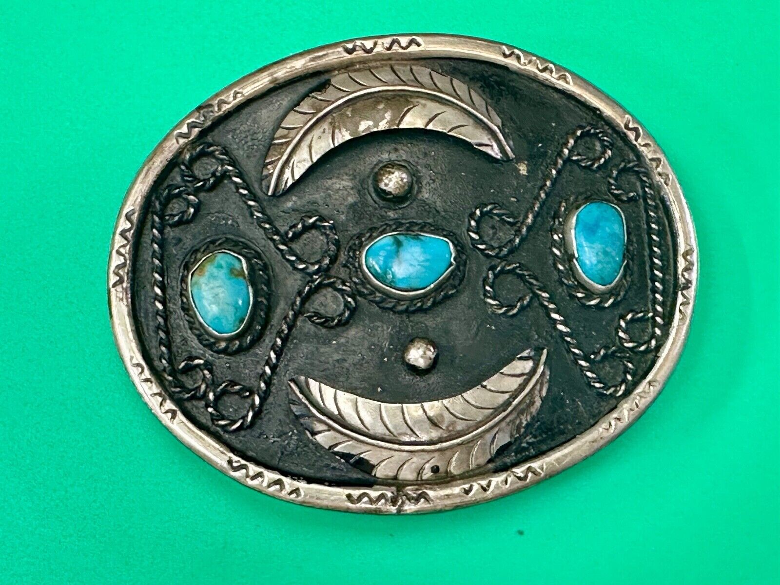 Turquoise stones raised feathers vintage belt buckle marked Sterling 0925 Mexico