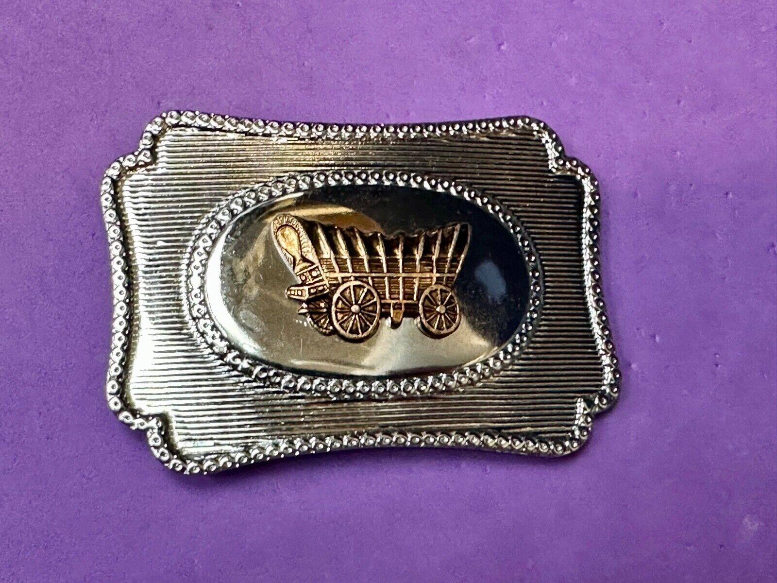 Vintage covered wagon western horse drawn transportation belt buckle