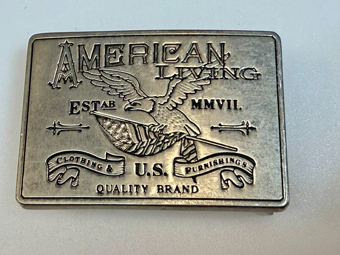 American Living Clothing & Furnishing U.S Quality Brand Promo Belt Buckle