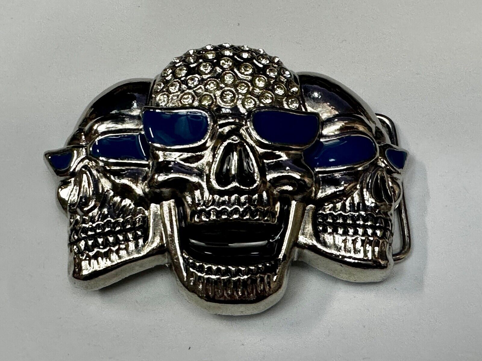 Three Skull's Heads Rhinestone Accented W/ Blue Shades Silver Tone Belt Buckle