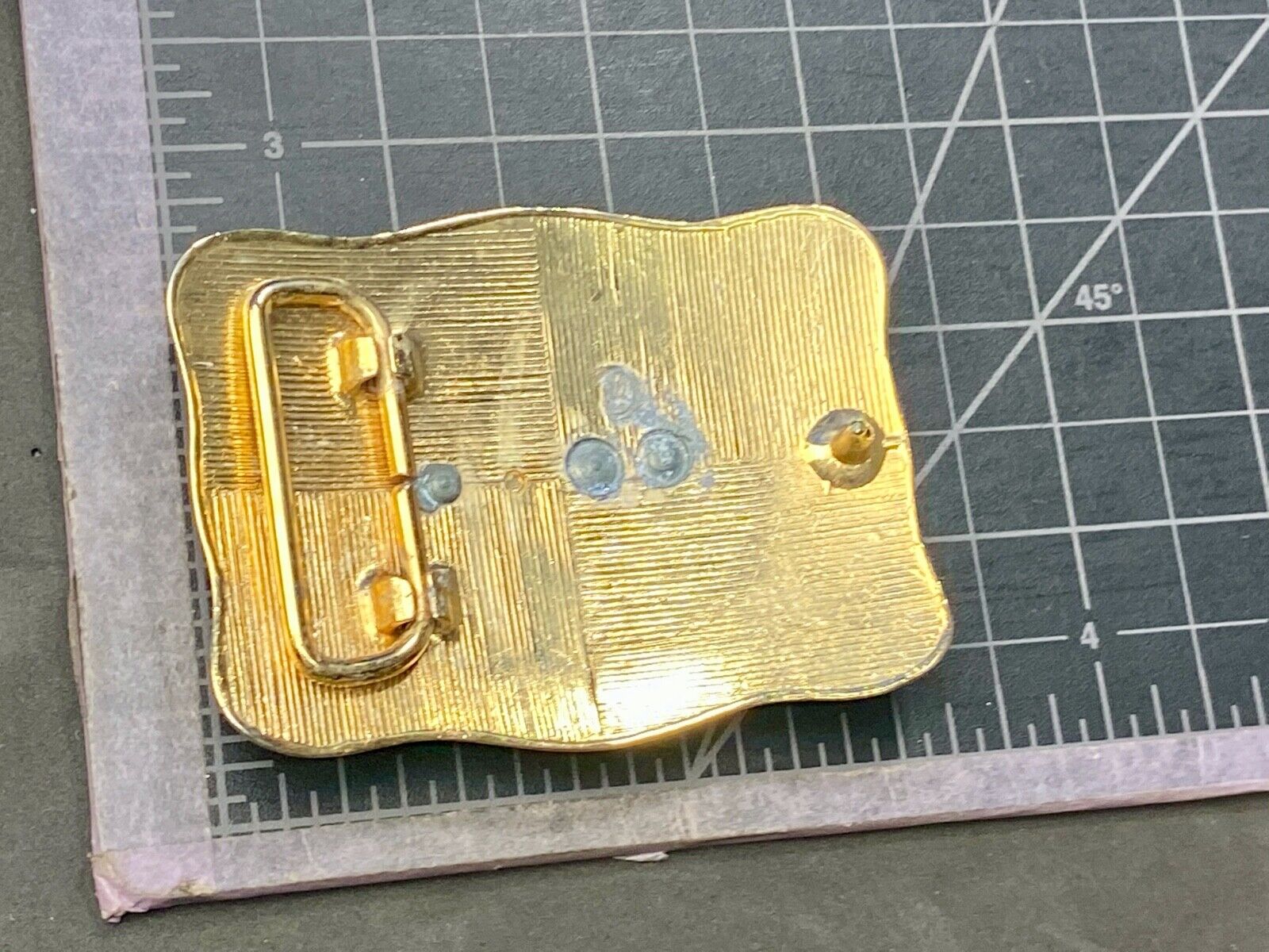 bull riding rodeo cowboy on beautiful gold color flower swirl belt buckle 