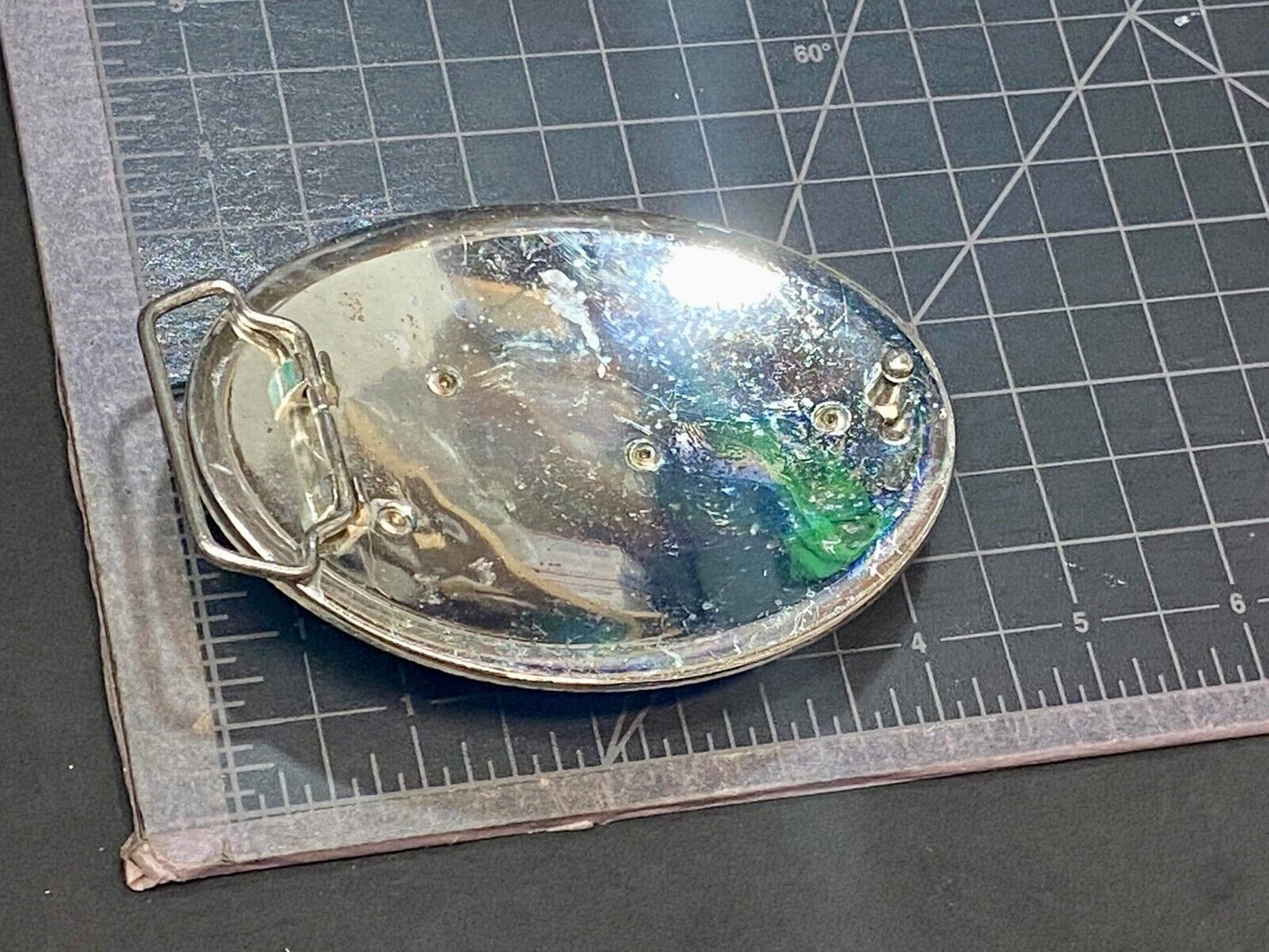 A big Tiger Cat running featured on western oval belt buckle 