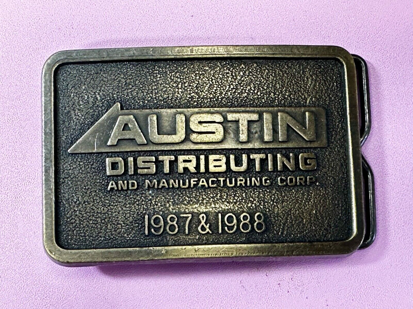 Austin Texas Distributing and Manufacturing 1987 Advertisement Promo Belt Buckle