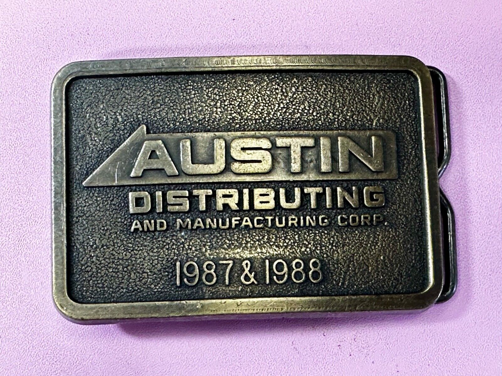 Austin Texas Distributing and Manufacturing 1987 Advertisement Promo Belt Buckle