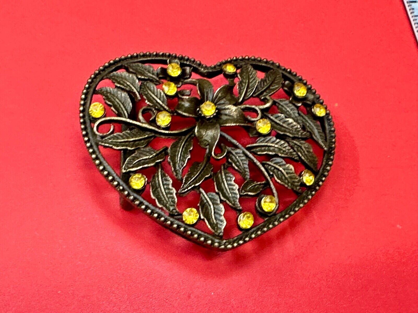 Beautiful see through Heart shaped belt buckle with yellow rhinestone accents