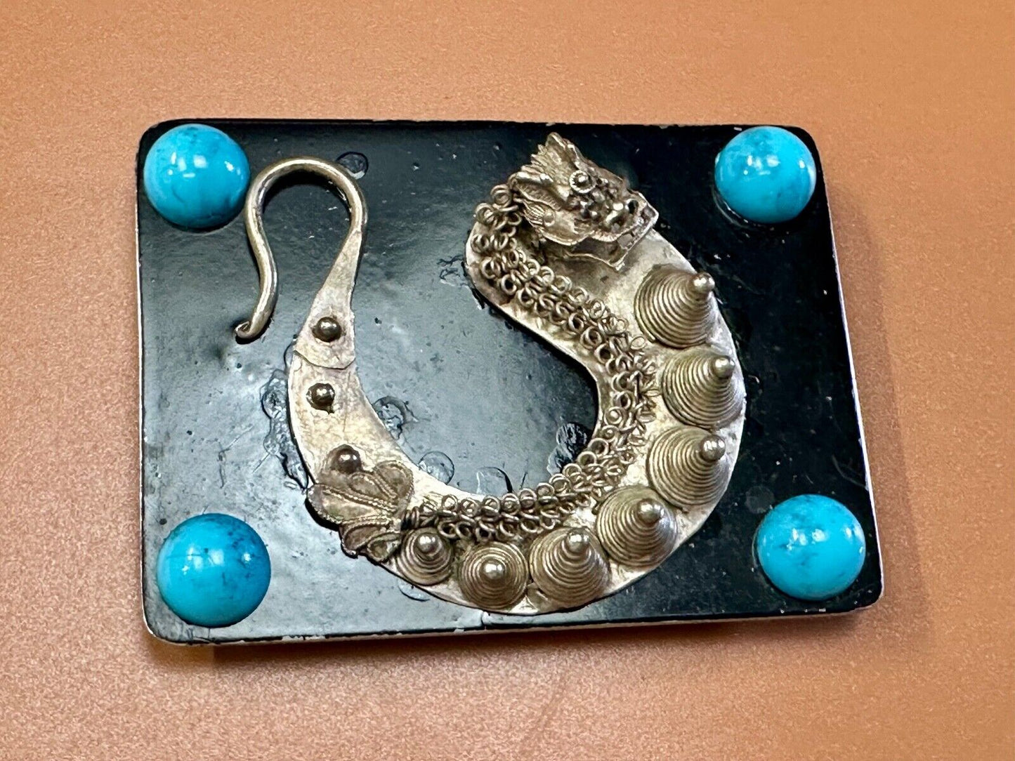 Artisan Dragon theme rectangular belt buckle with turquoise colored corner accts
