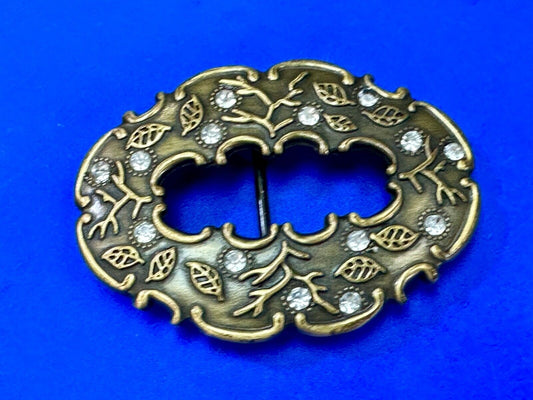 3" wide brown rhinestone accented leaf pattern semi oval belt buckle