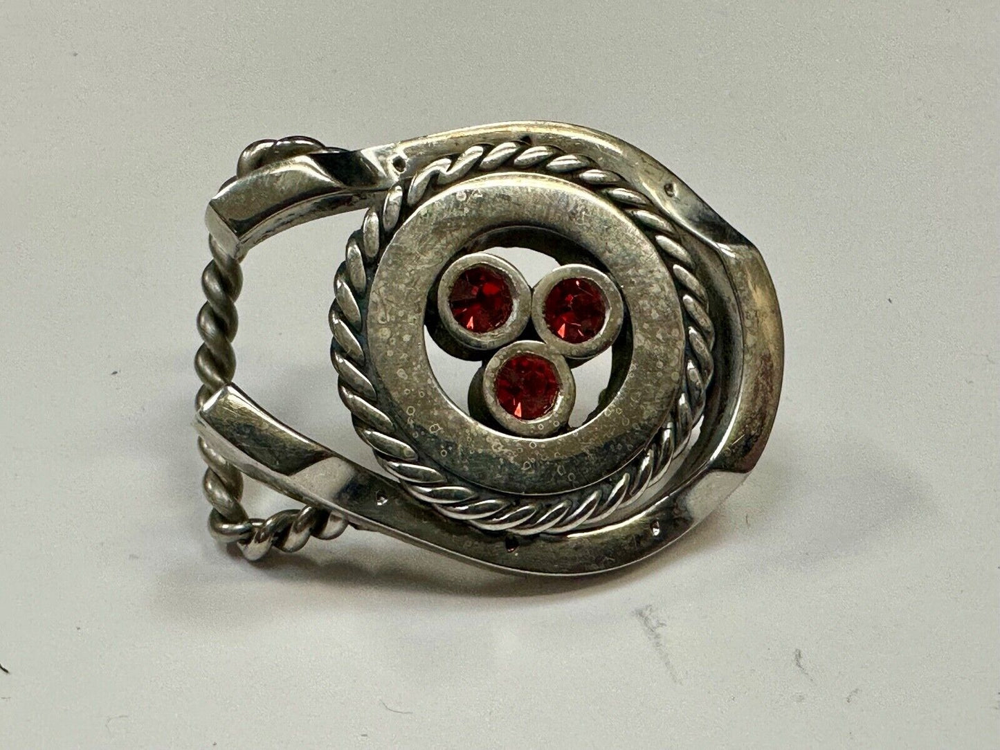 artisan circle pattern rope centerpiece red dots horseshoe shaped belt buckle