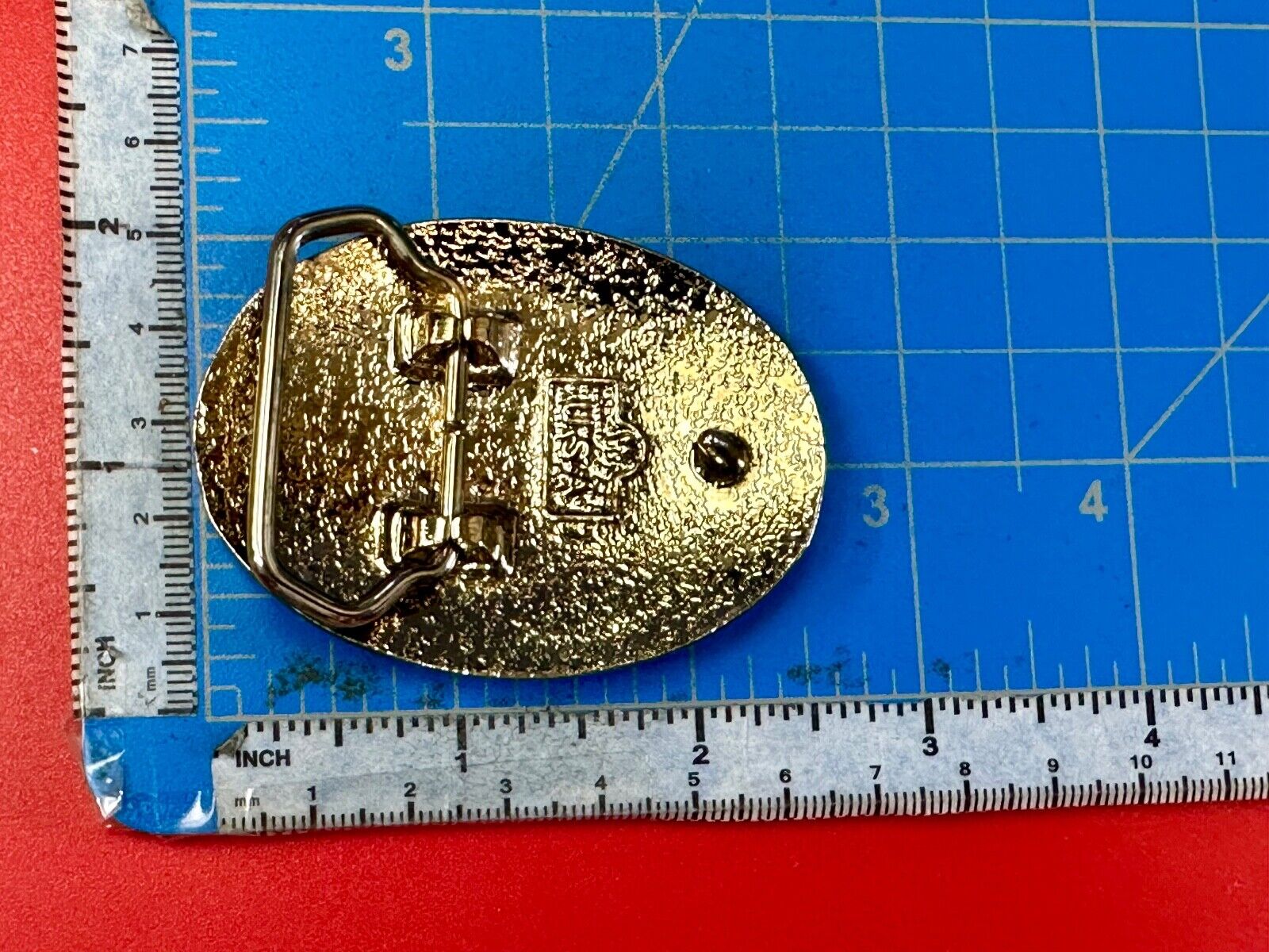 vintage gold tone starburst design oval belt buckle marked W