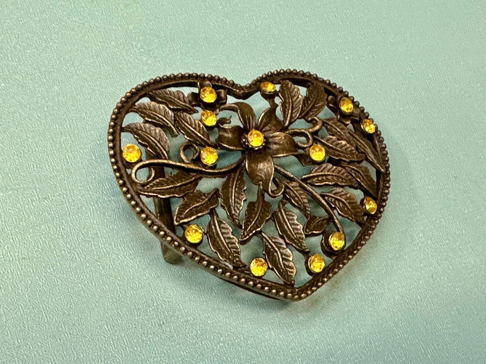Beautiful see through Heart shaped belt buckle with yellow rhinestone accents