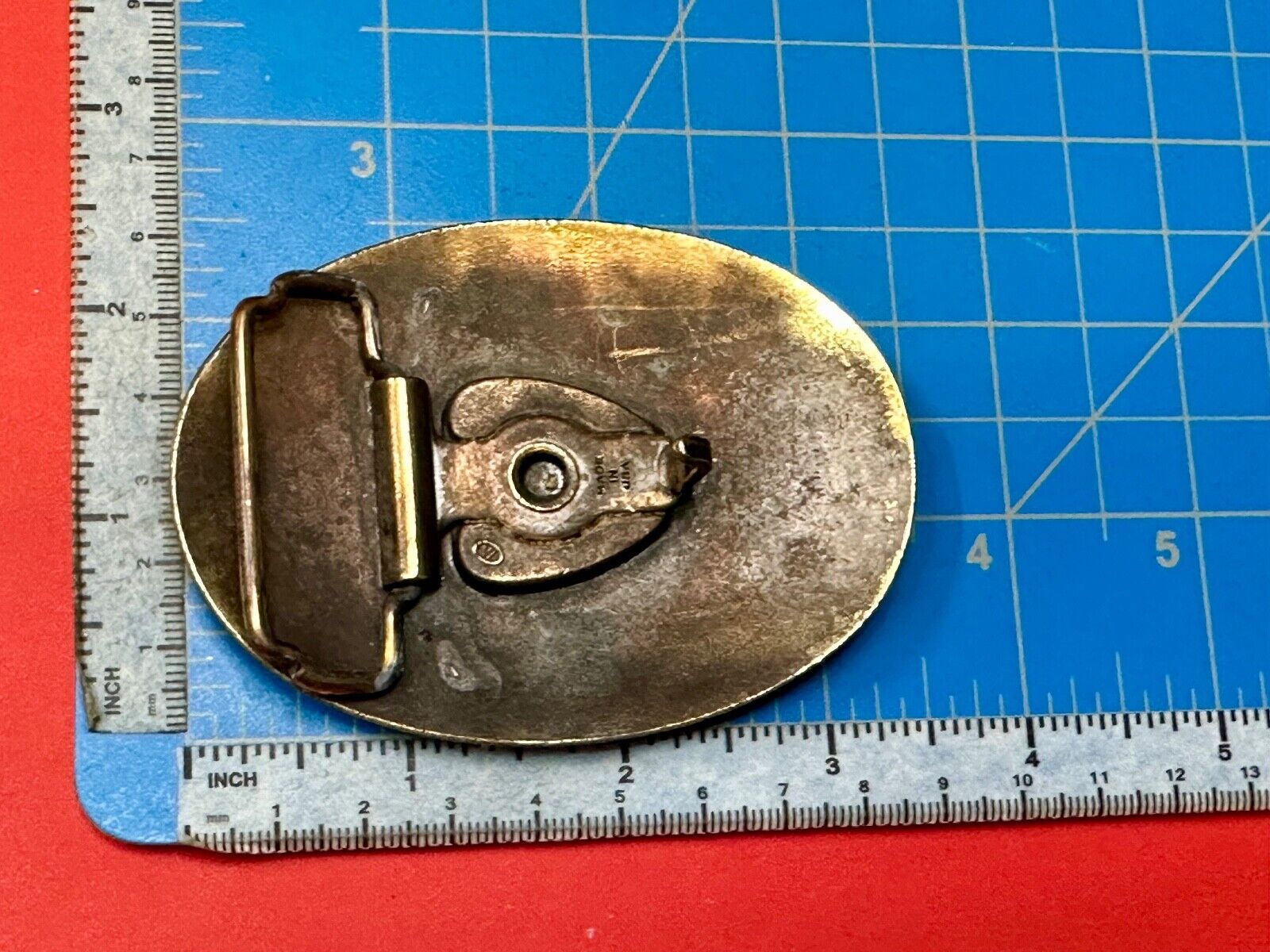 USA made vintage western flower swirl design oval belt buckle marked W