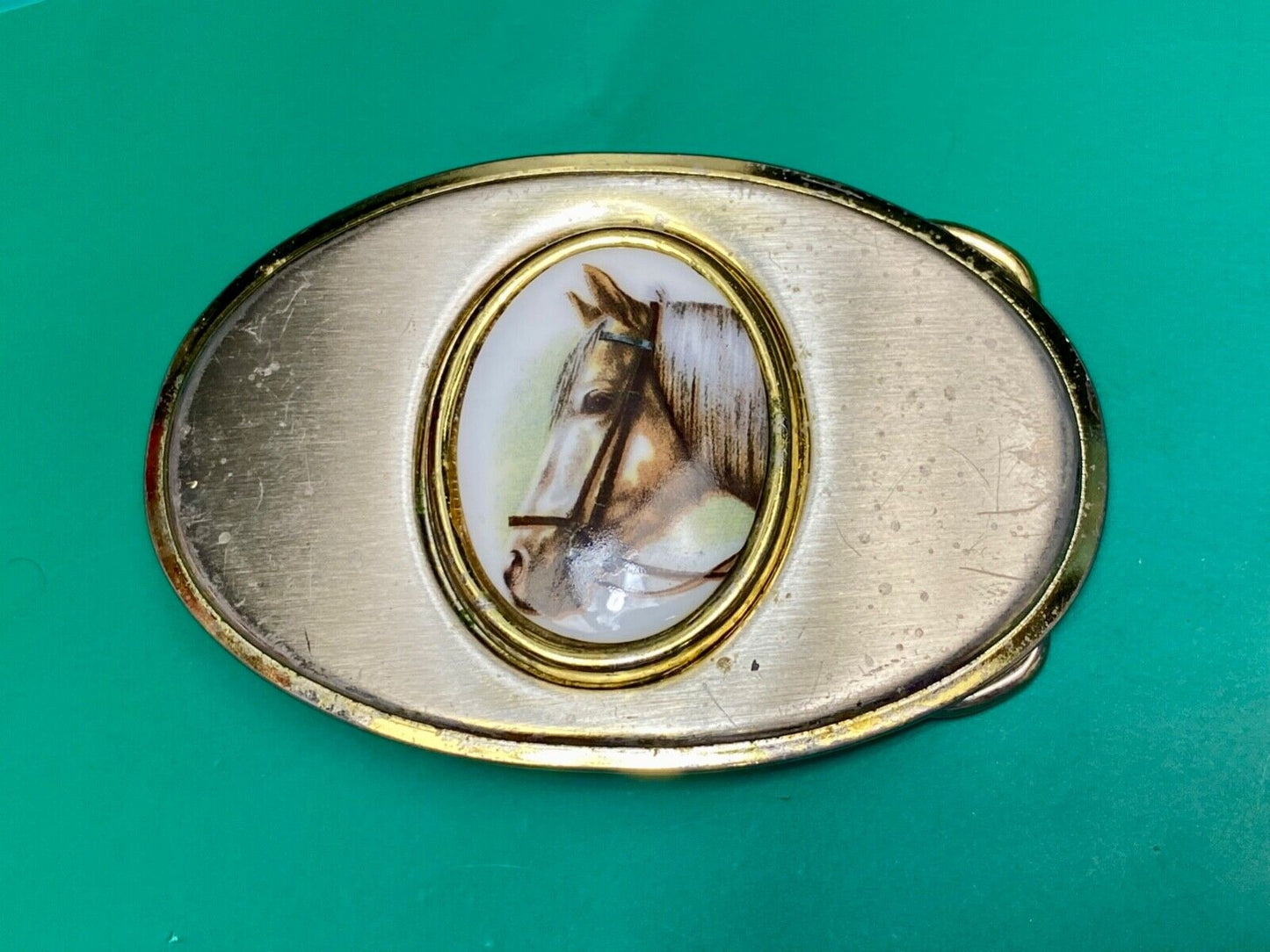 Vintage horse head picture centered in western belt buckle