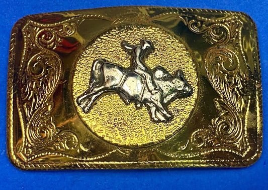 Beautiful ornate solid brass rodeo cowboy on rectangular western belt buckle 