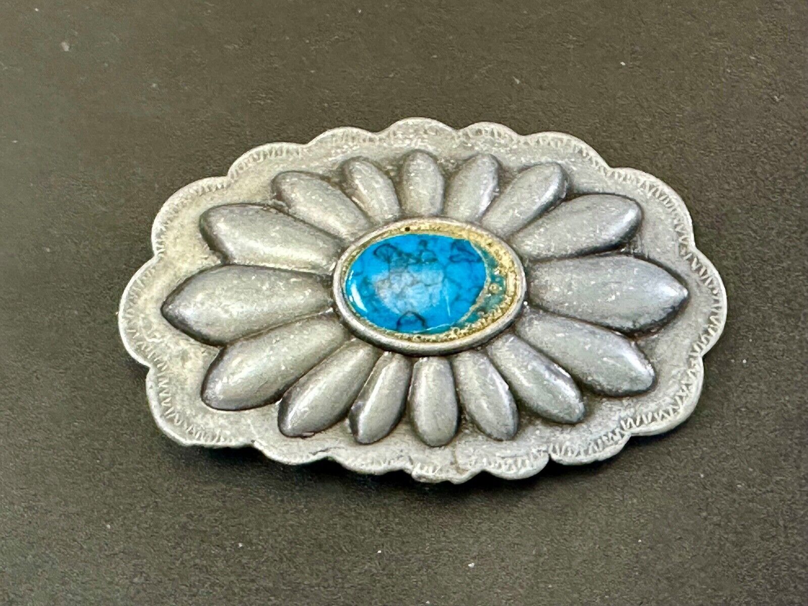 Turquoise stone centered on Vintage metal flower theme belt buckle