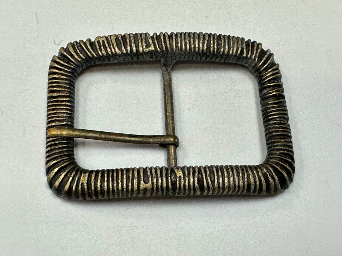 Unique Center Bar Spring abstracted wrapped style rectangular belt buckle