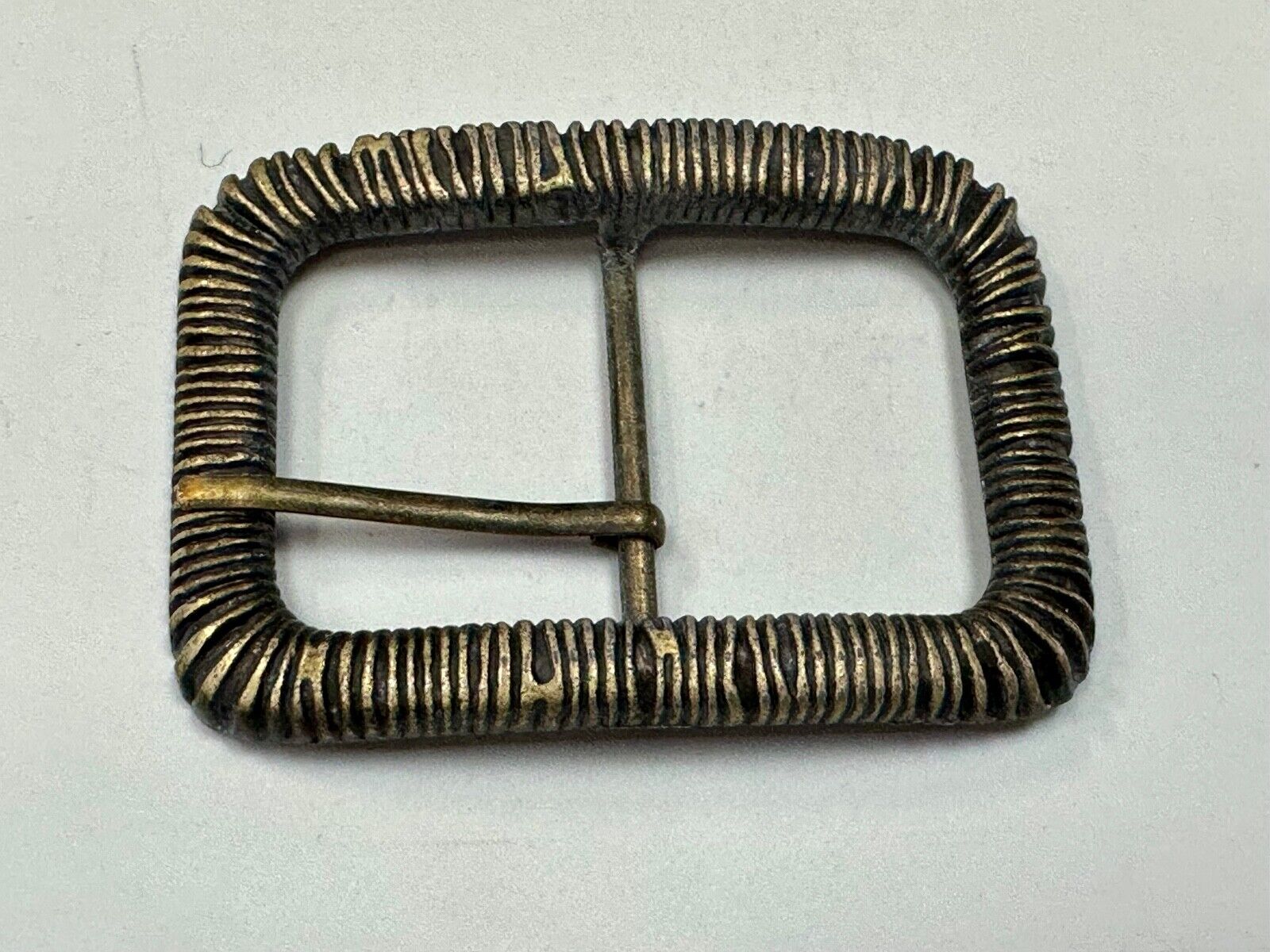 Unique Center Bar Spring abstracted wrapped style rectangular belt buckle