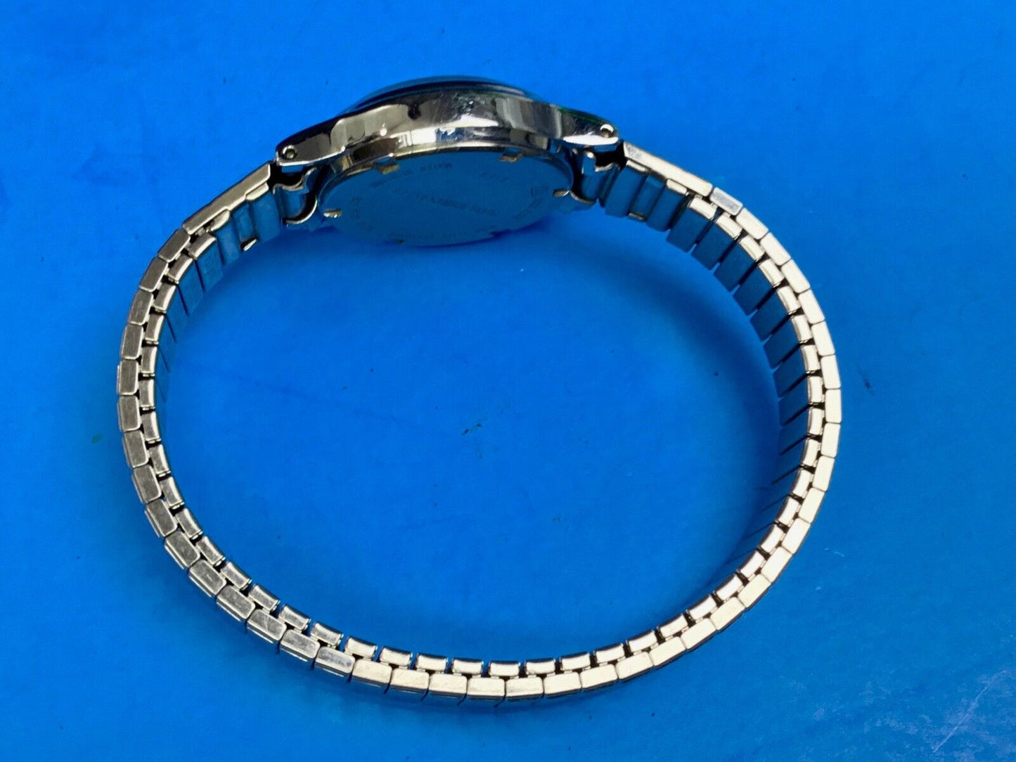 Vintage  Ladies Silver Tone Watch Phasar Quartz Date Stretch V227-0130 R 