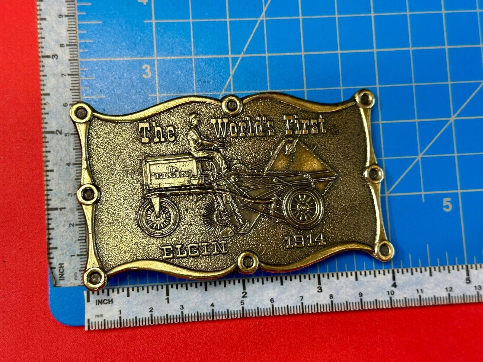 The Elgin, The worlds first tree sweeper commemorative belt buckle by Lewis