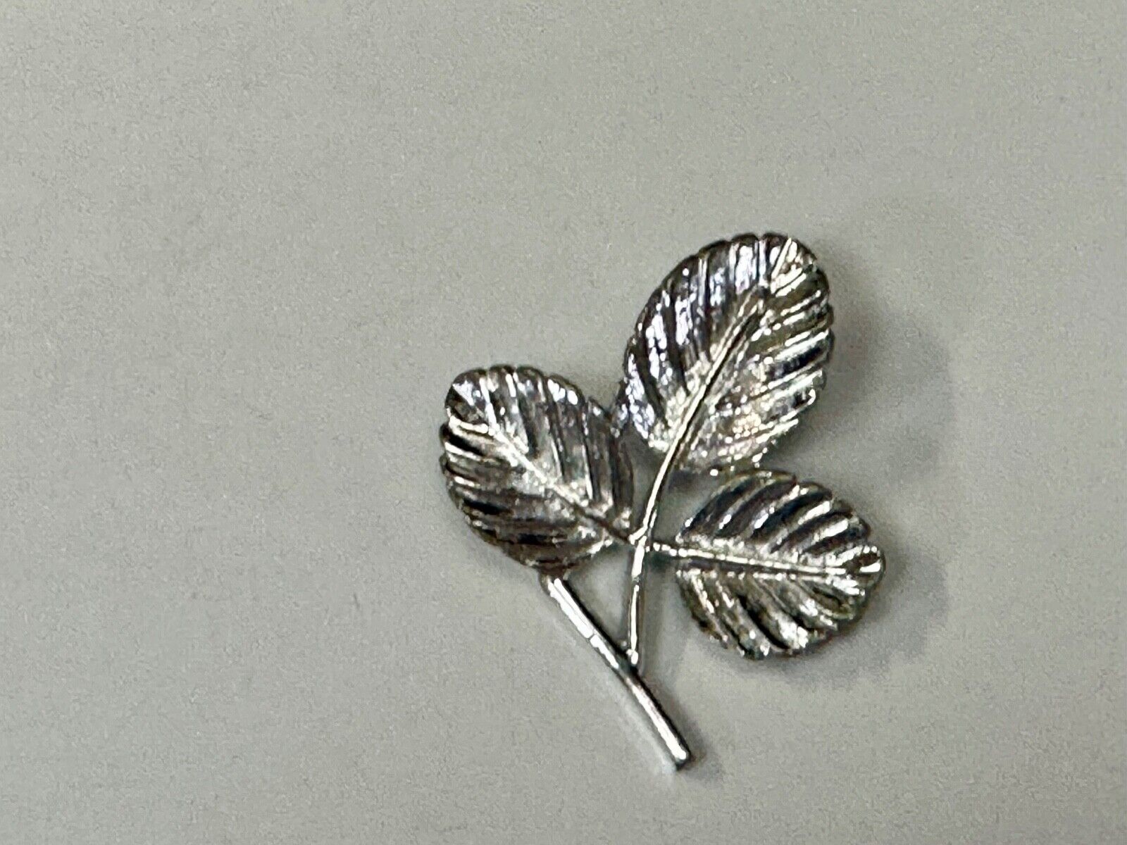 Three Leaf cutout Sarah Coventry signed silver tone brooch pin