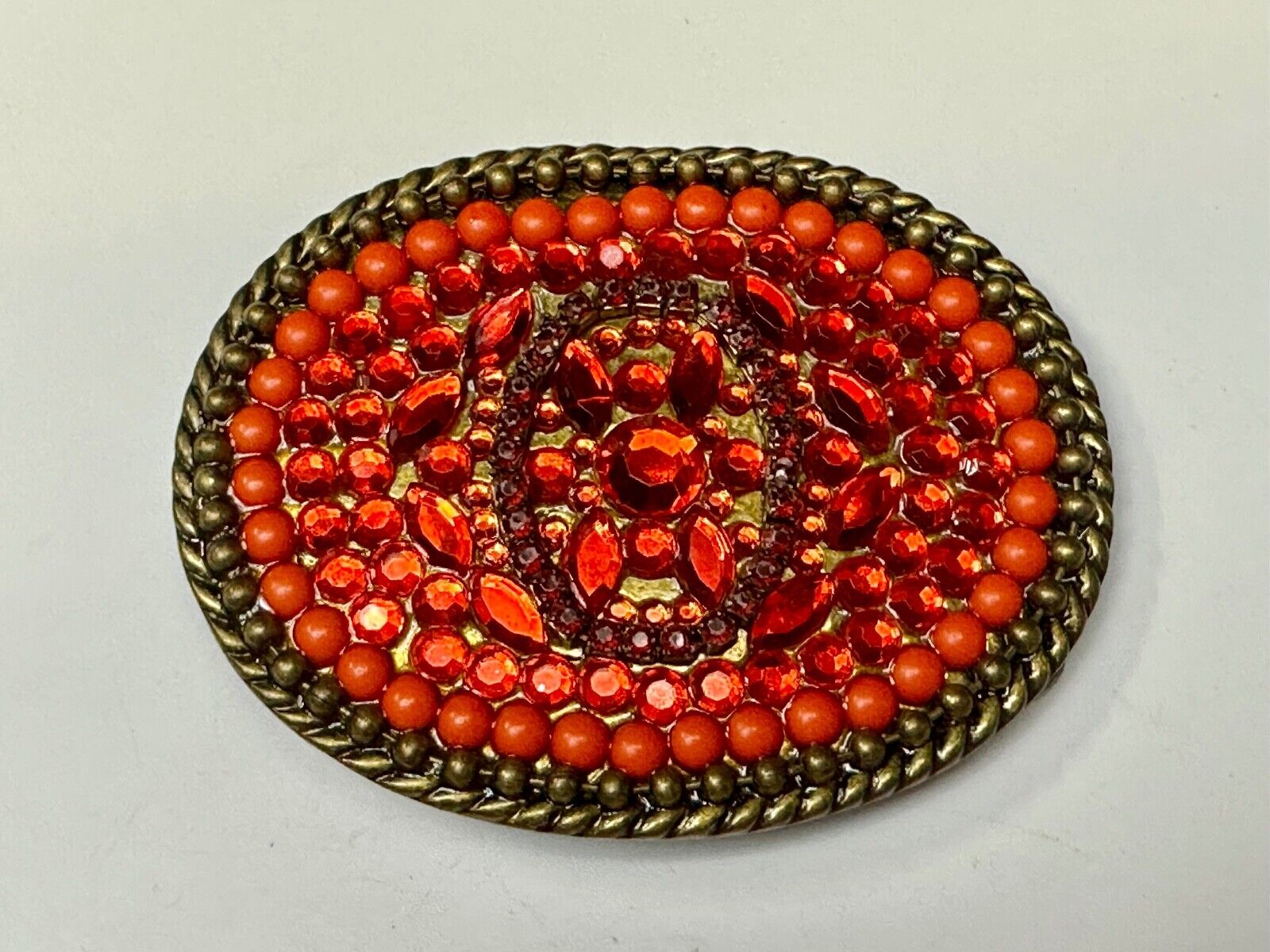Unique Shades of Red - Mixed Materials oval outlined Belt Buckle