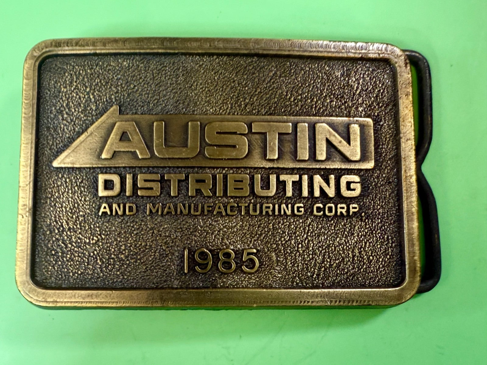Austin Texas Distributing and Manufacturing Corp 1985 NOS RJ Belt Buckle