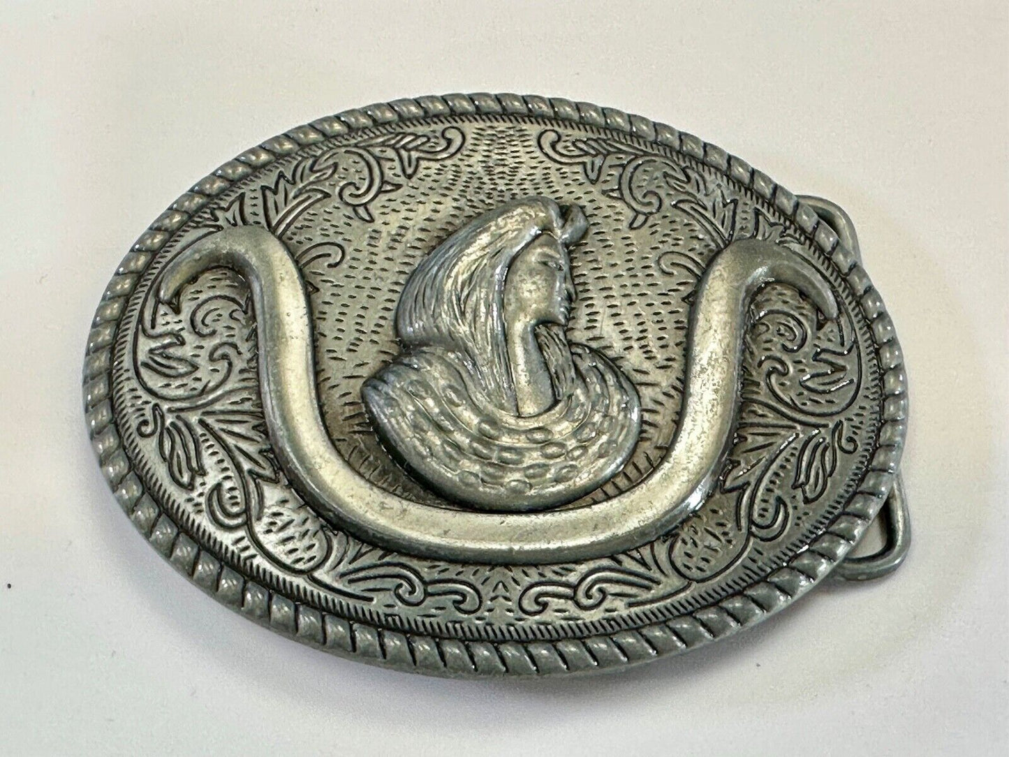 unknown to me!   Man with long hair - longhorn wester belt buckle