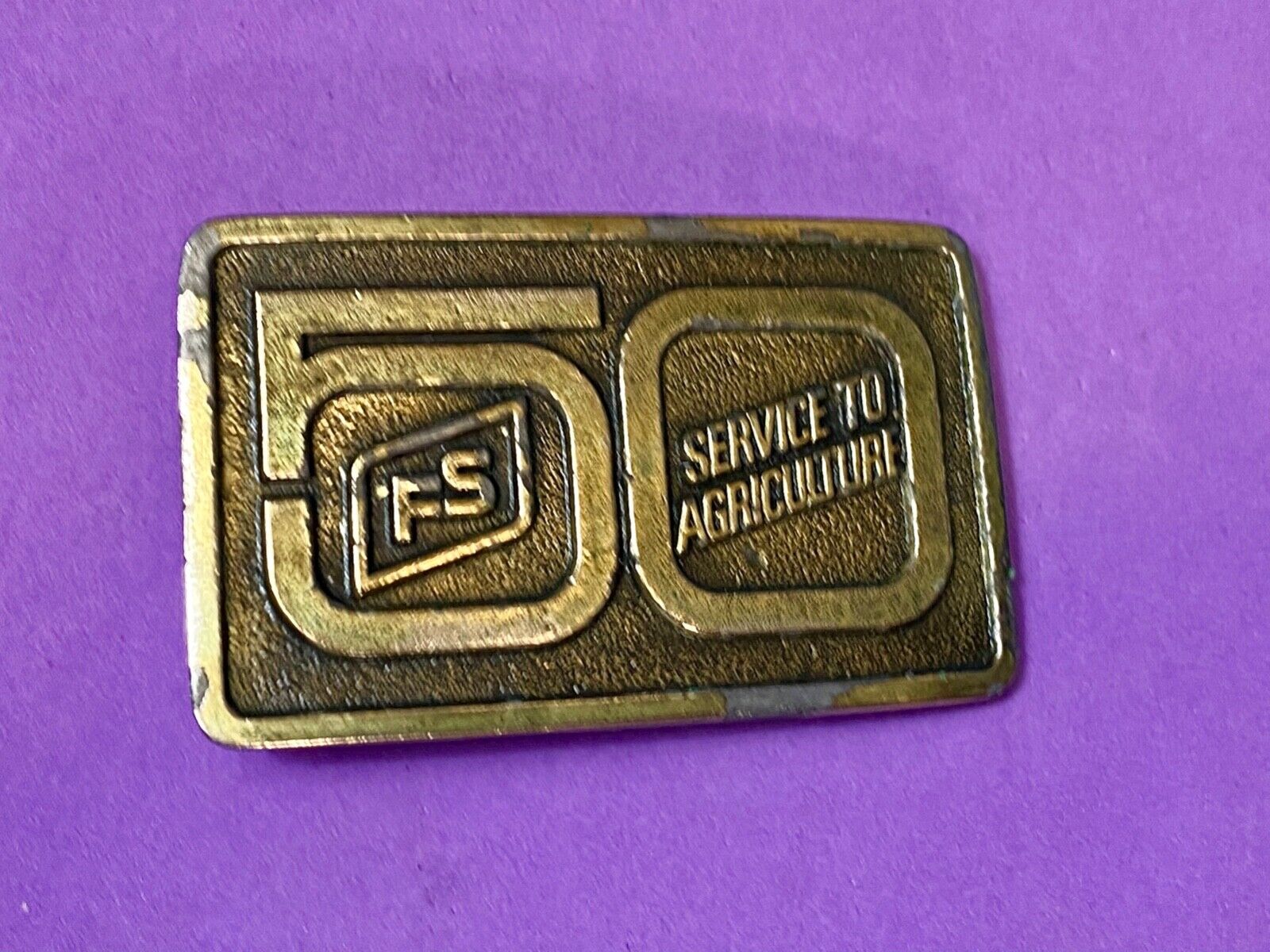 50 years, Farm Service to Agriculture belt buckle by Wyoming Studio Art works