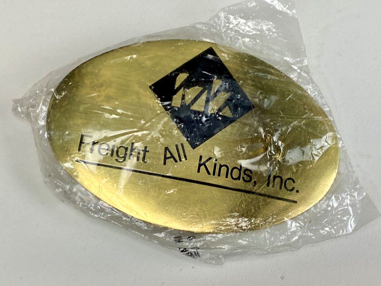 Vintage Freight all kinds, INC. promotional brass belt buckle 
