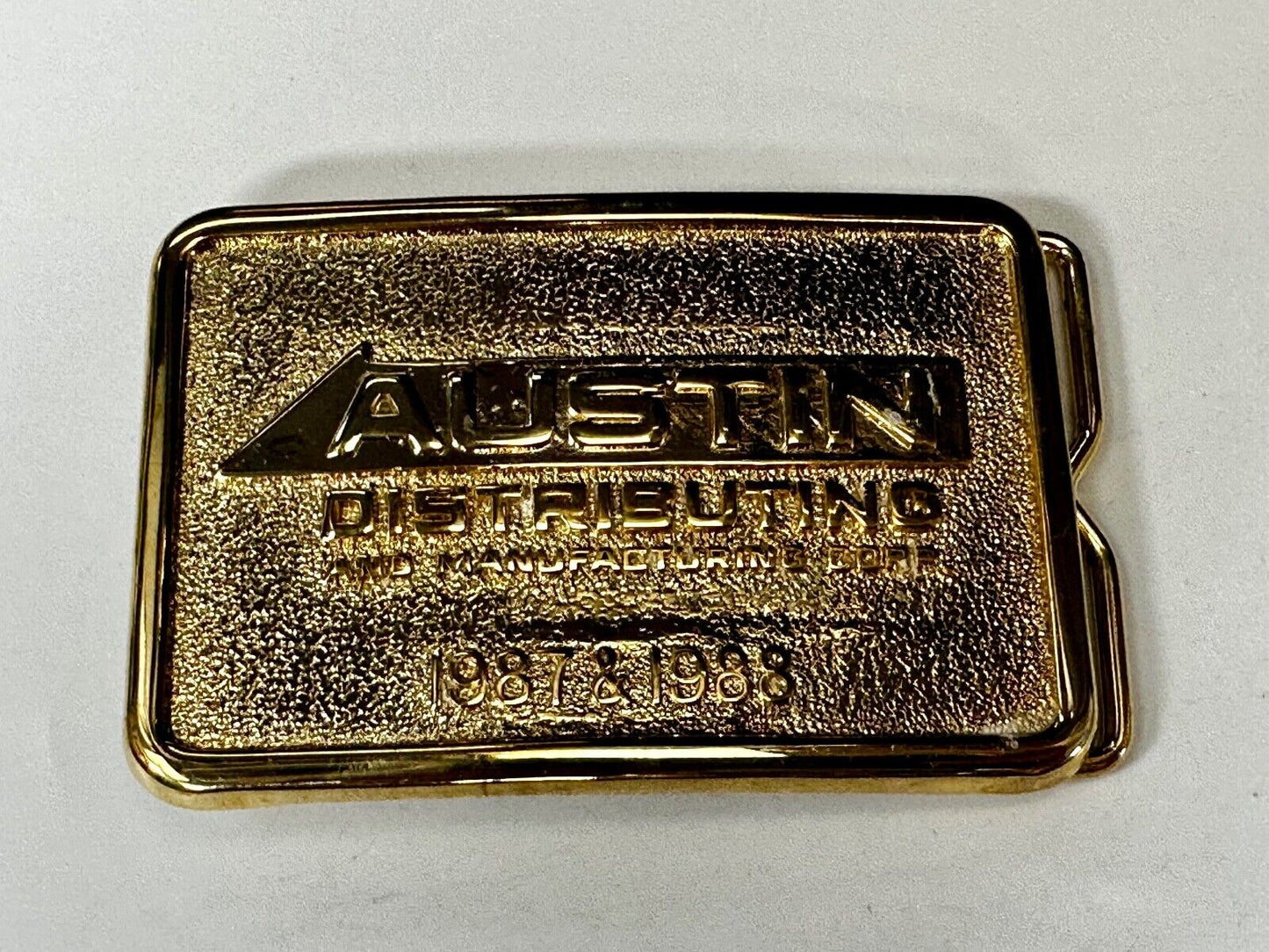 Austin Texas Distributing and Manufacturing 1987 - 1988 Gold Tone Belt Buckle