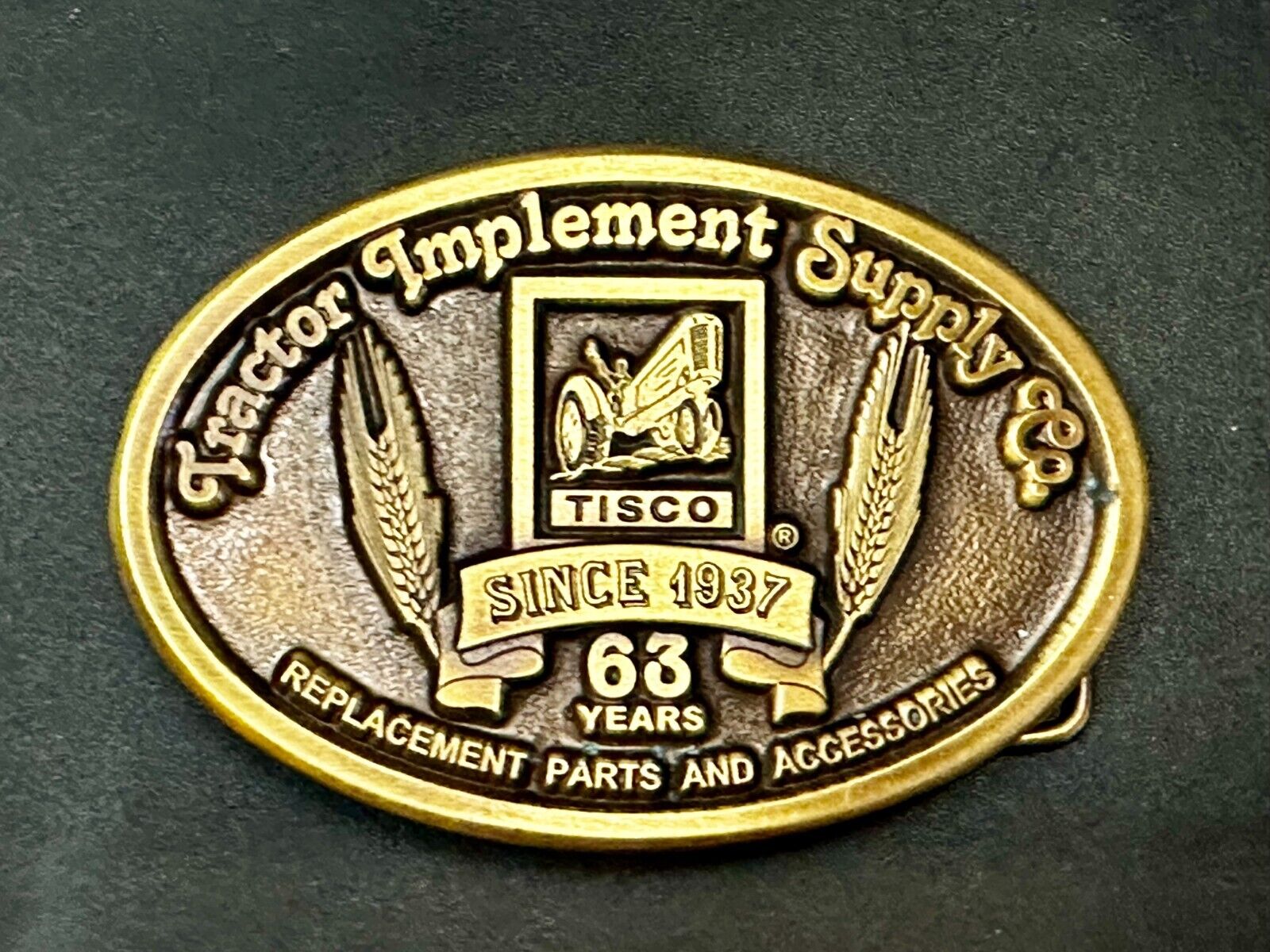63 years TISCO Tractor Implement Supply company Vintage Belt Buckle by Speccast