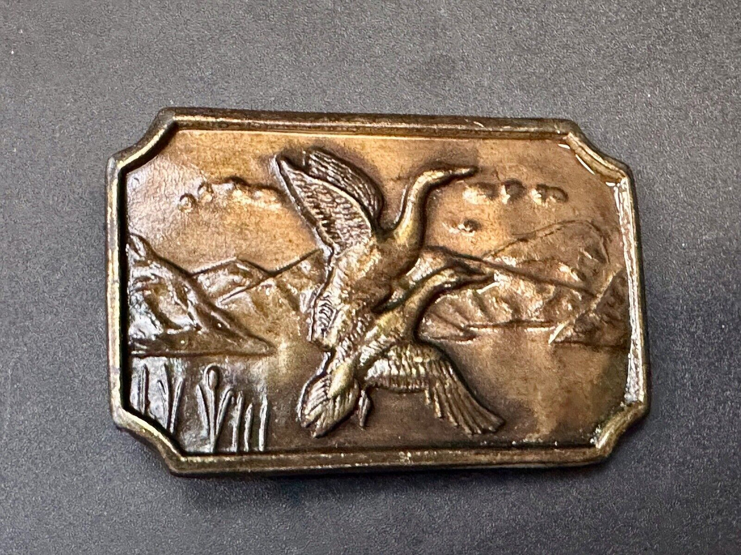 Two ducks flying from pond - Vintage nature scene belt buckle