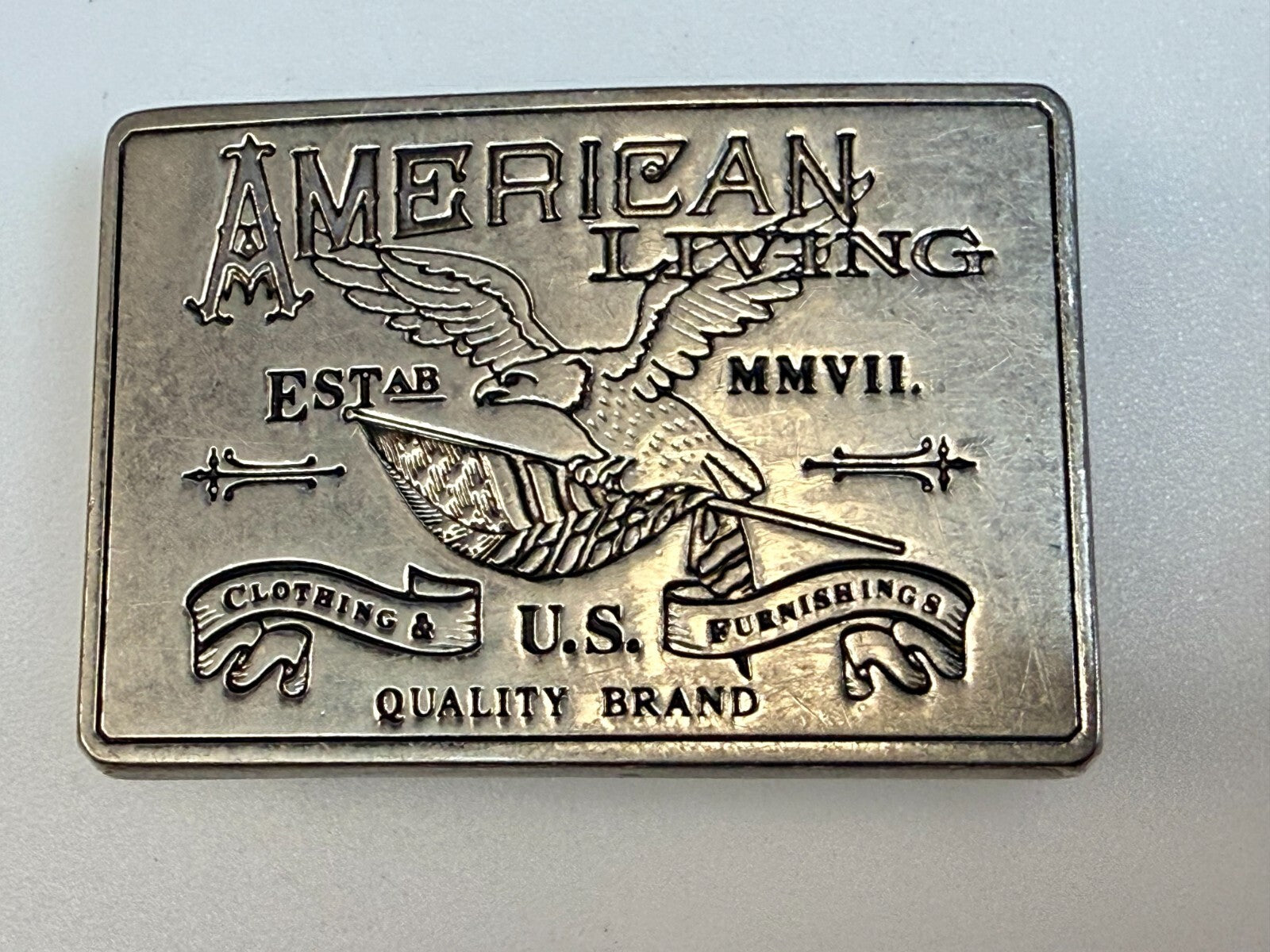 American Living Clothing & Furnishing U.S Quality Brand Promo Belt Buckle