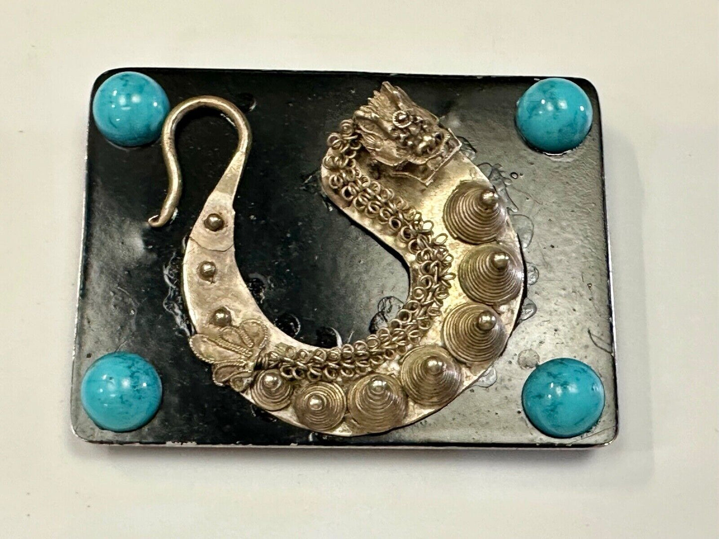 Artisan Dragon theme rectangular belt buckle with turquoise colored corner accts