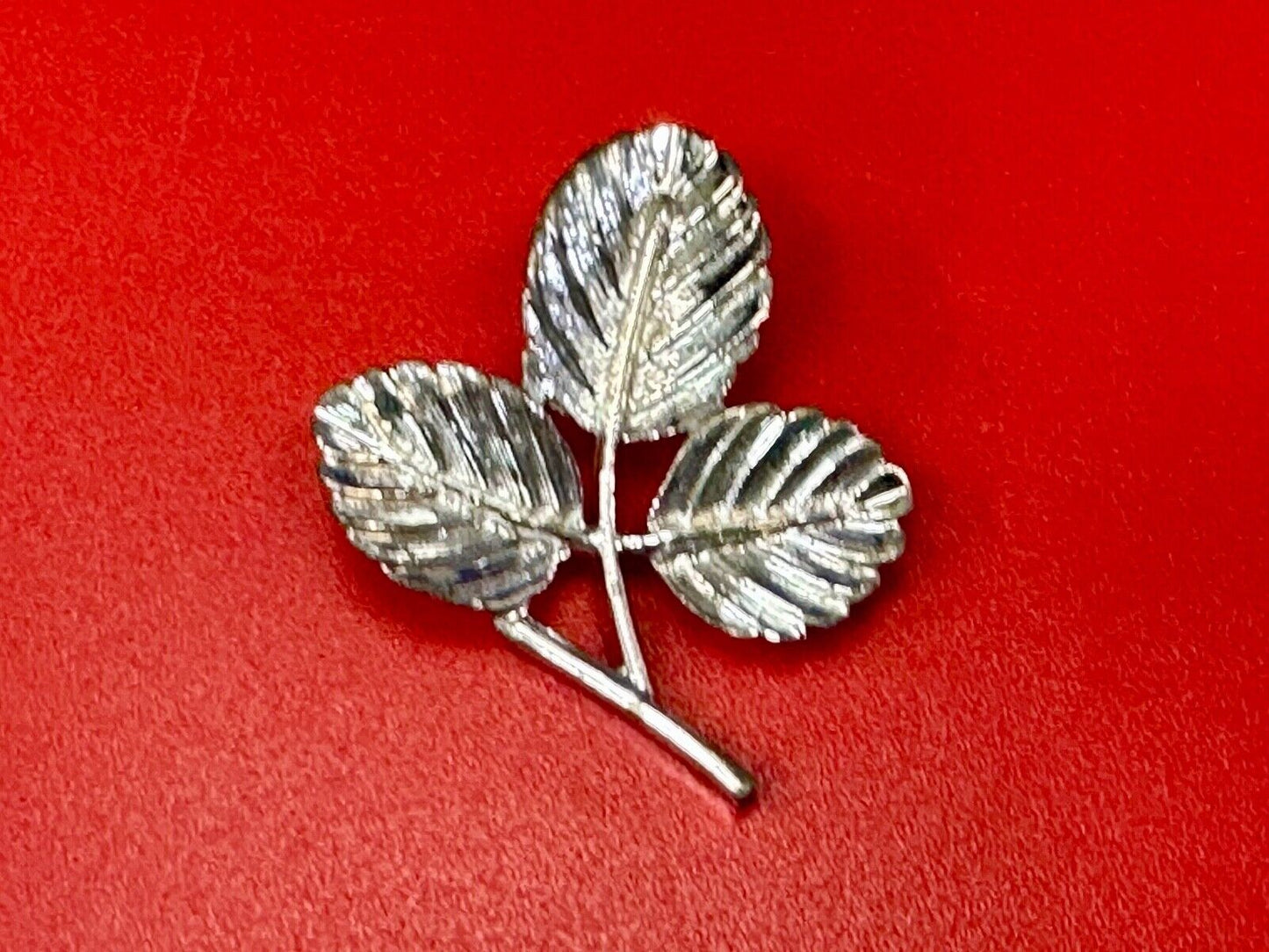 Three Leaf cutout Sarah Coventry signed silver tone brooch pin