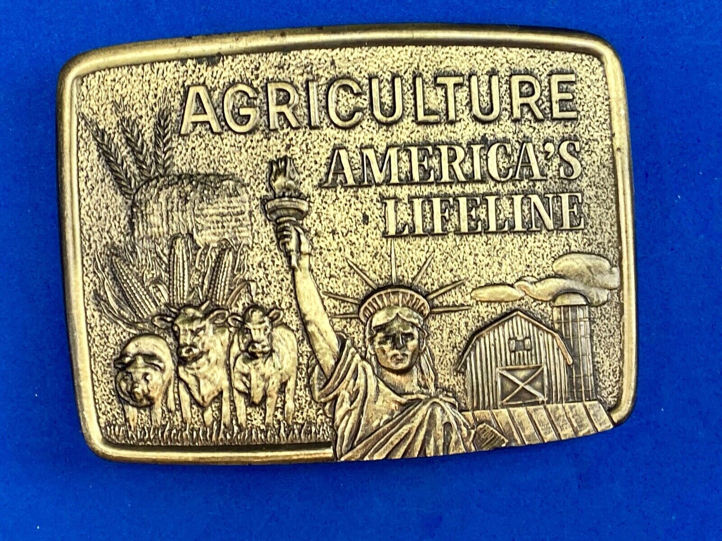 AGRICULTURE, Americas Lifeline belt buckle by Farmhand Statue of liberty 