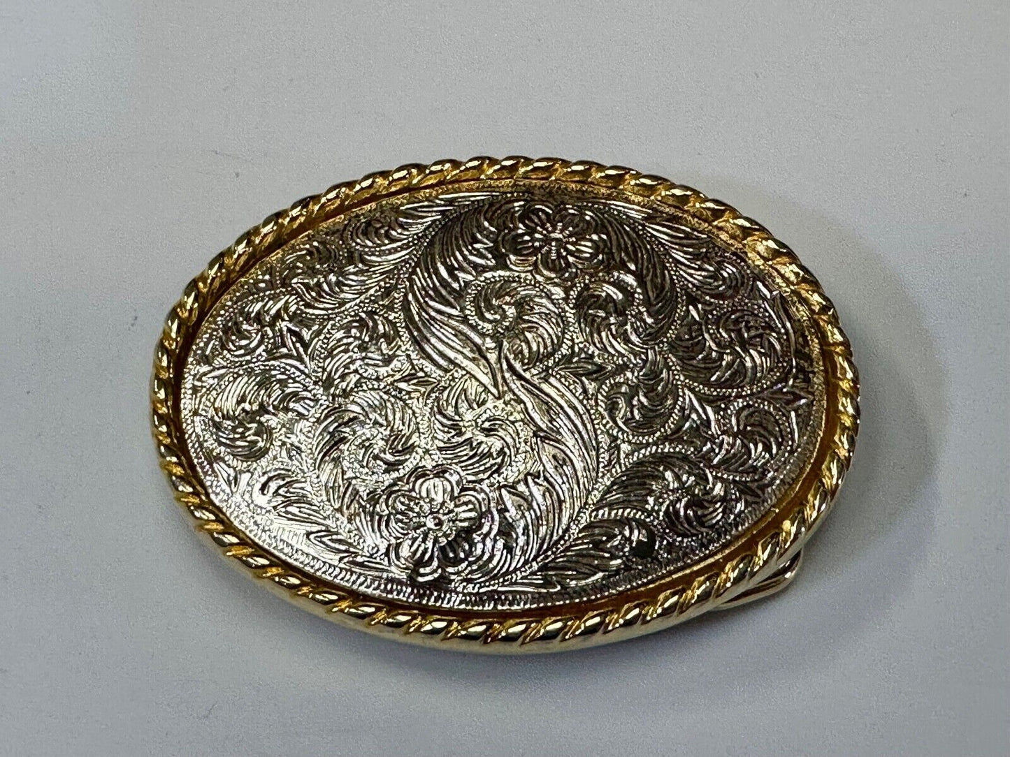 vintage Ivan Brand western flower swirl design two tone oval belt buckle