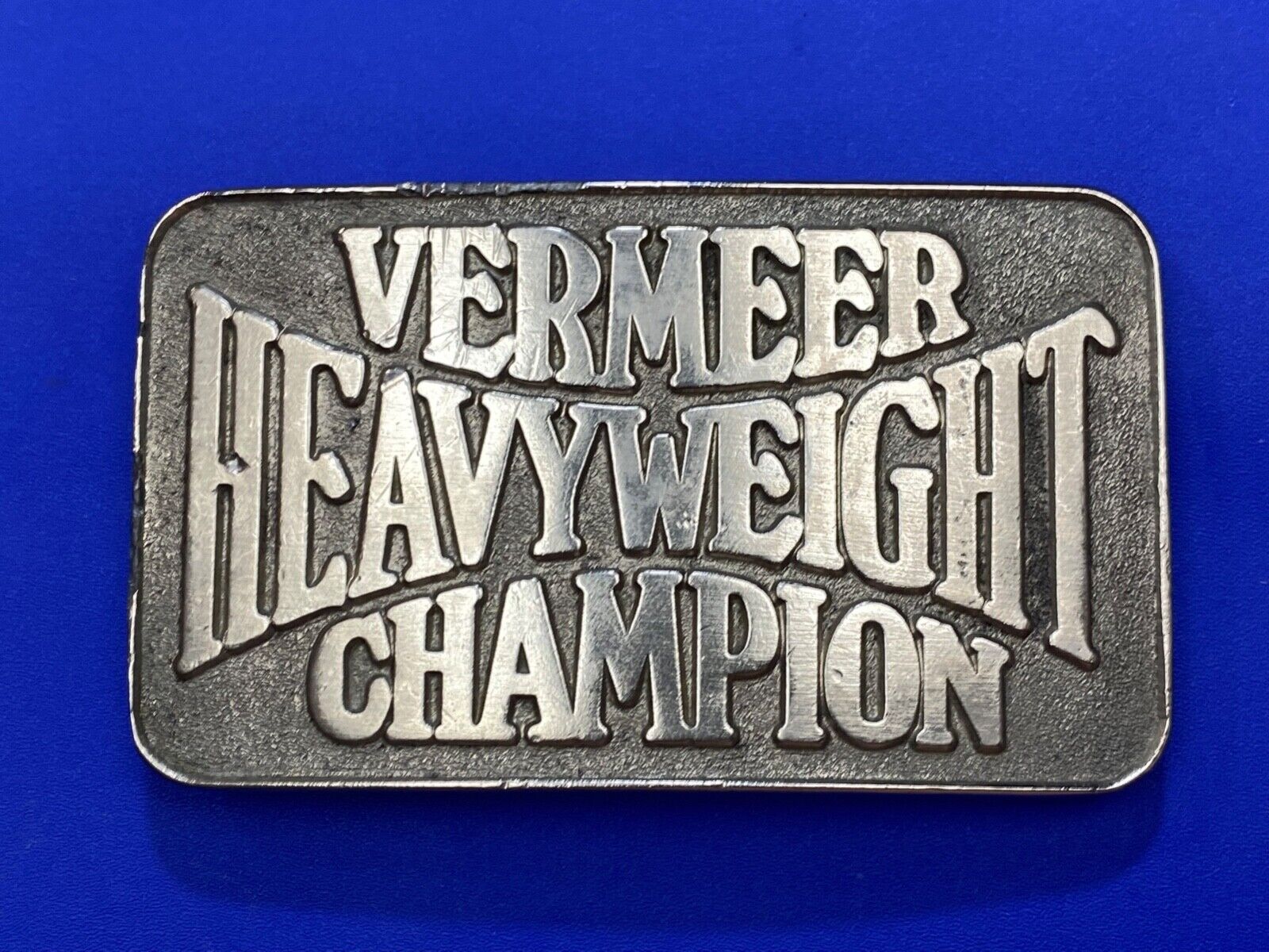 Vermeer Heavyweight Champion Belt Buckle by Spec Cast