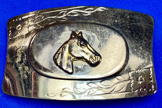 Vintage horse head on western belt buckle