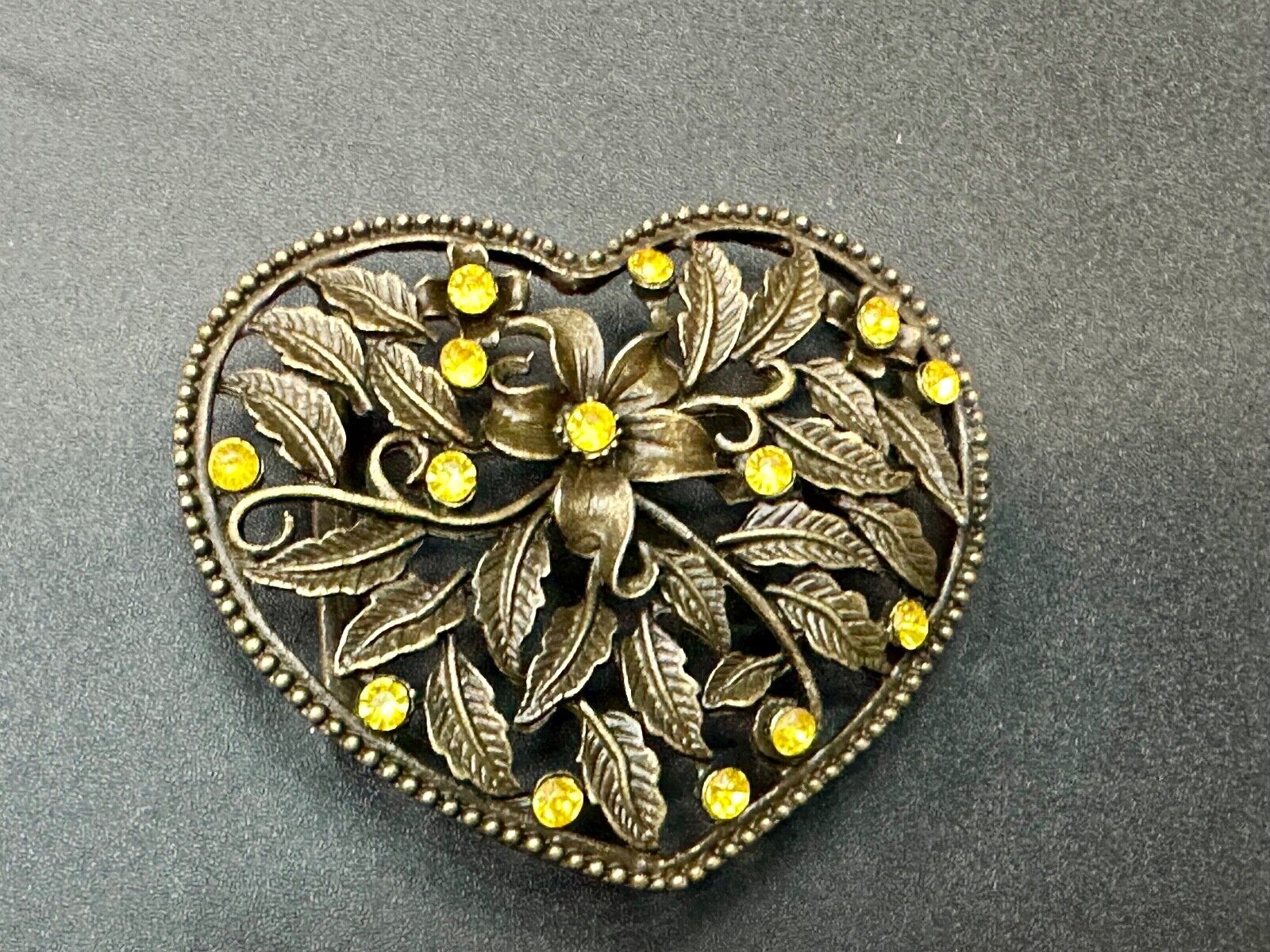 Beautiful see through Heart shaped belt buckle with yellow rhinestone accents