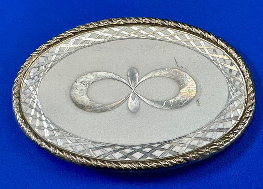 Vintage etched figure 8 pattern oval silver tone belt buckle