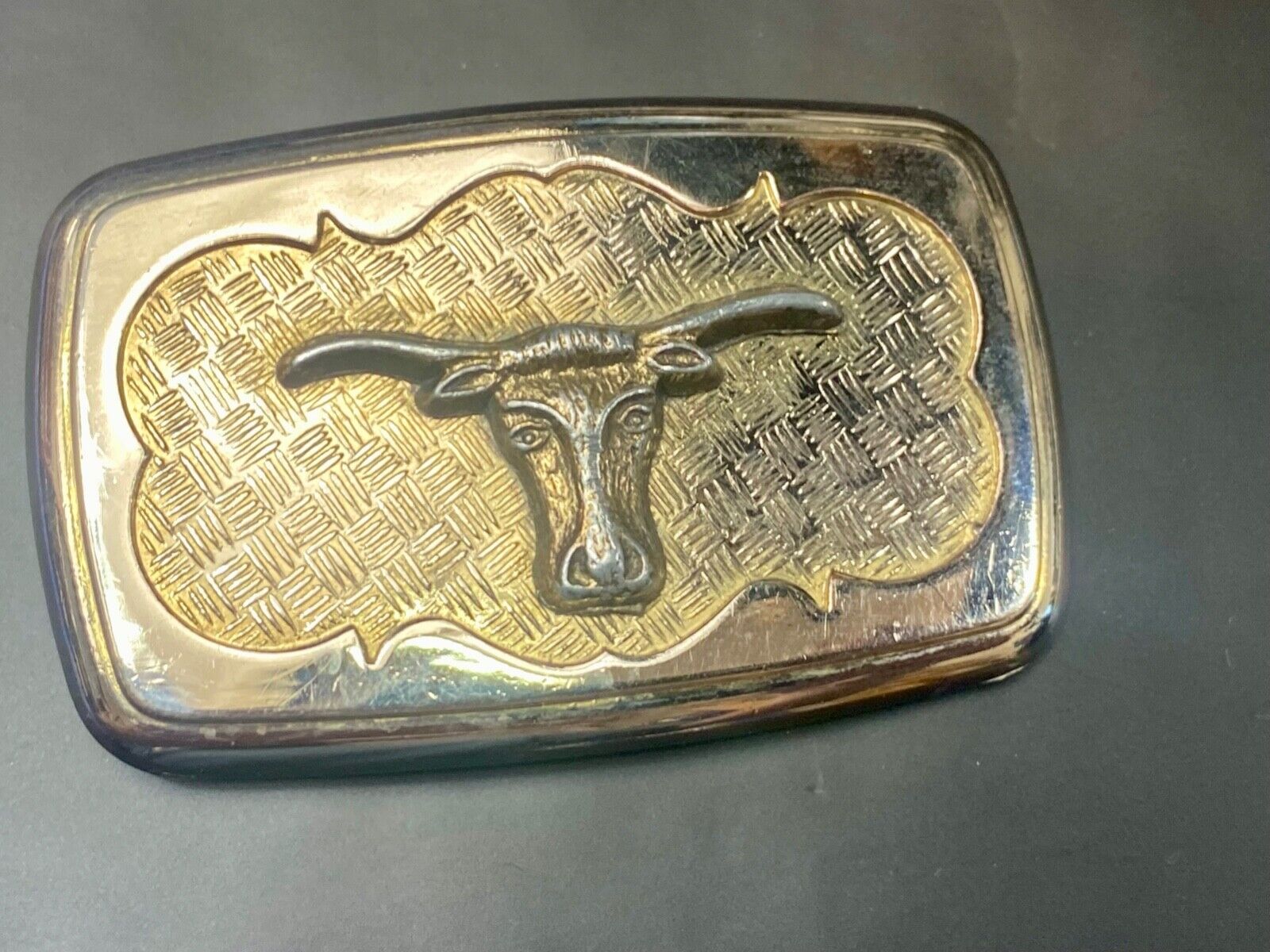 Vintage gold tone Texas Longhorn Steer mesh background western belt buckle
