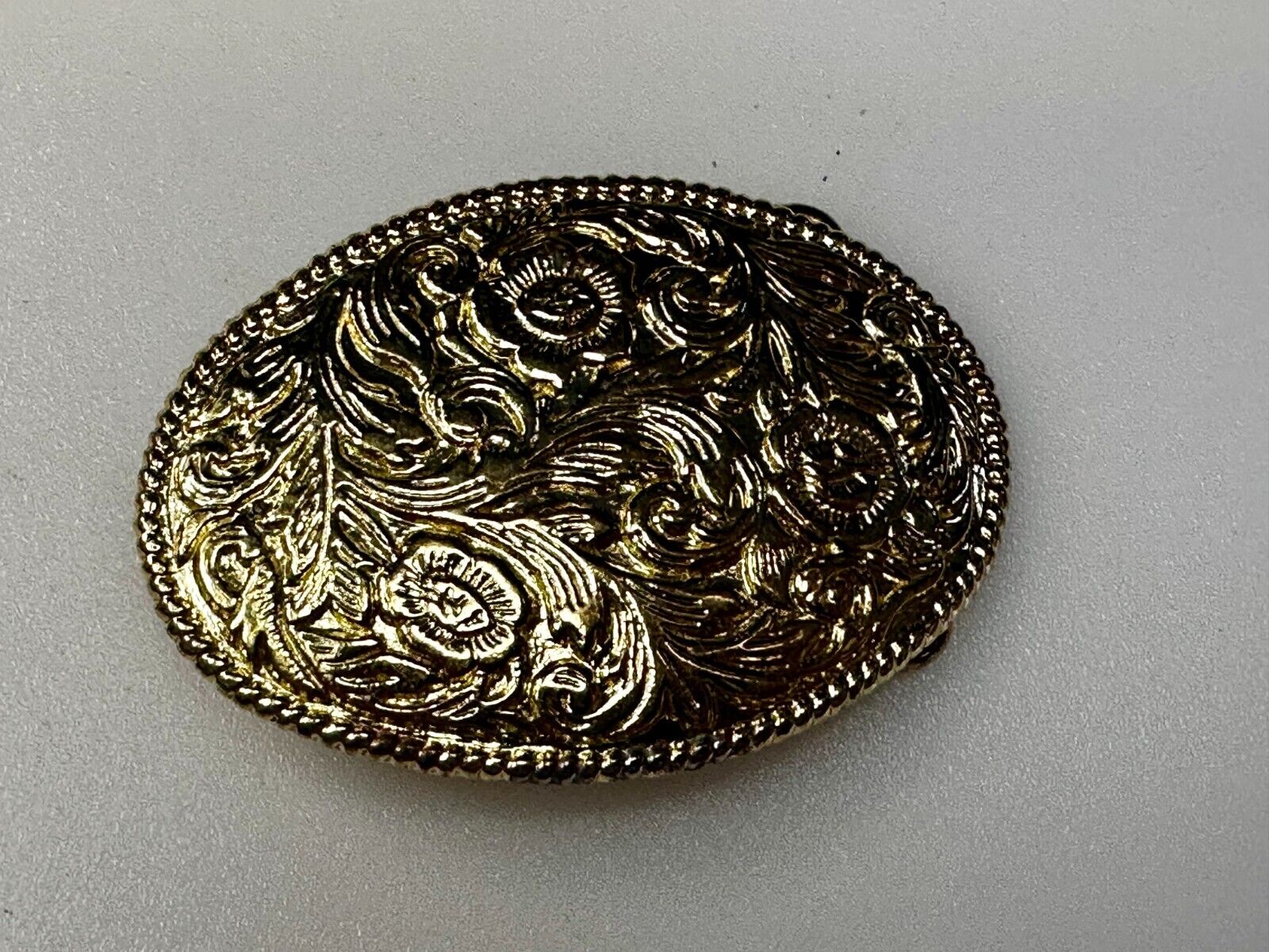 Vintage gold tone western flower swirl design belt buckle